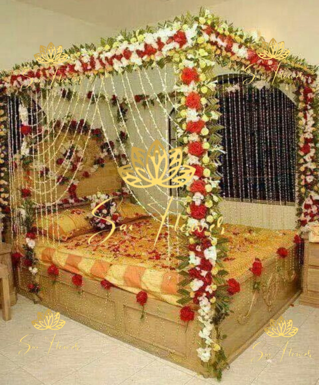 “Classic red and white jasmine canopy bed decoration with fresh roses and hanging flower strings by SaiFlower for wedding and anniversary setups”