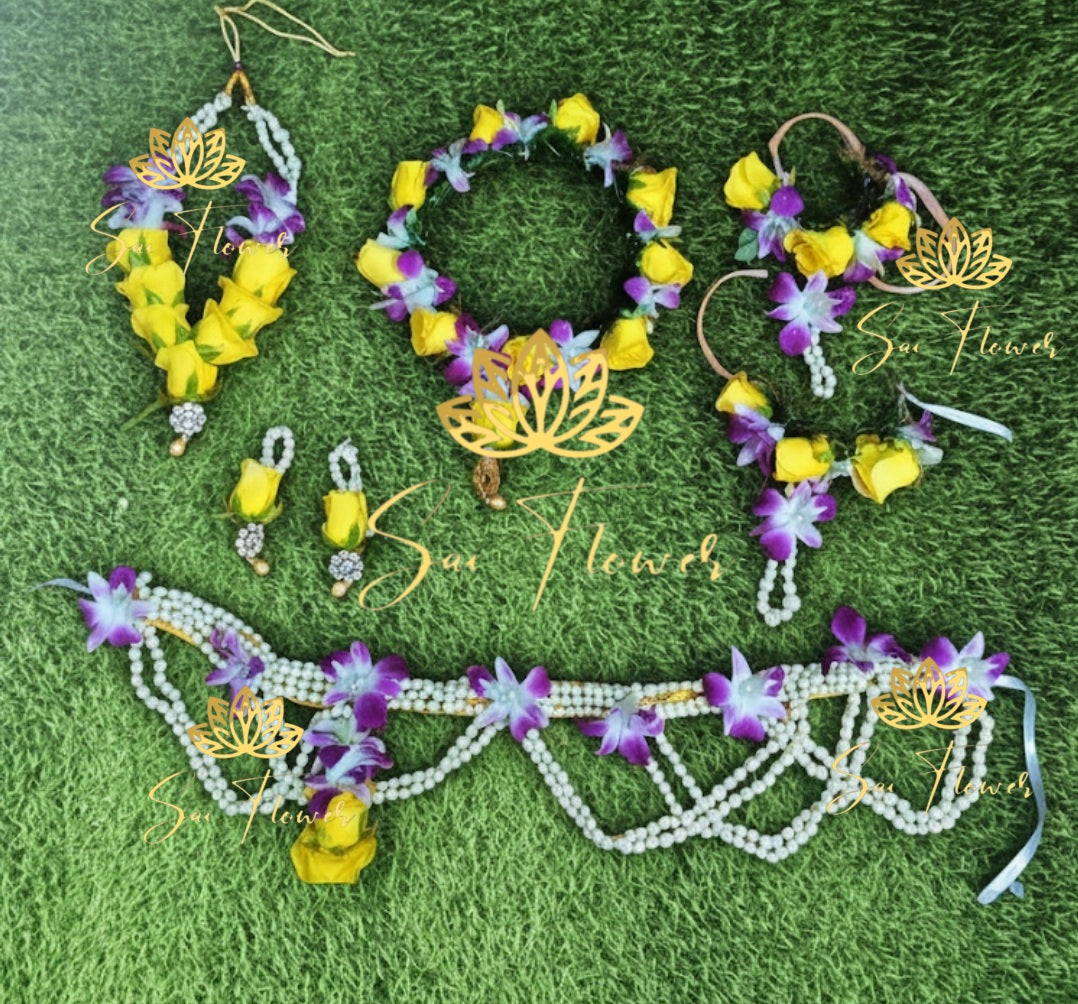 “Yellow and purple fresh flower bridal jewellery set with necklace, earrings, maang tikka, haathphool, and pearl kamarbandh handcrafted by SaiFlower”