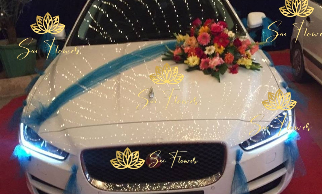 Elegant mixed flower car decoration with blue drapes and fresh roses by SaiFlower – on-site wedding car setup
