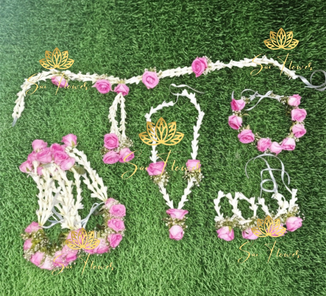 “Light pink and jasmine fresh flower bridal jewellery set with necklace, earrings, maang tikka, and haathphool handcrafted by SaiFlower”