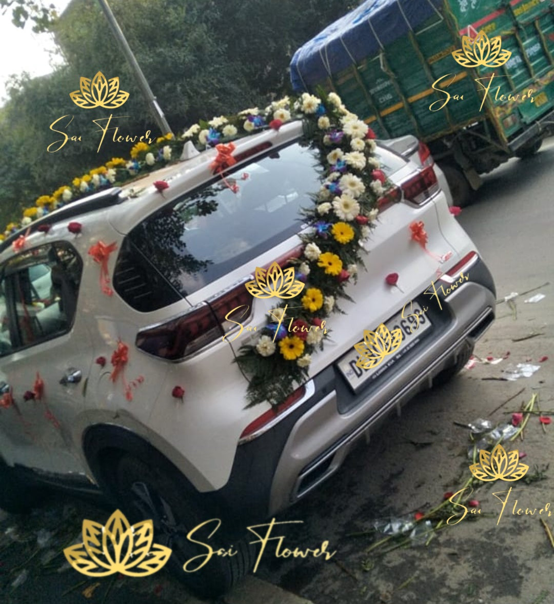 “Full wedding car decoration with fresh mixed flowers including roses, gerberas & orchids by Sai Flower in Delhi NCR.”