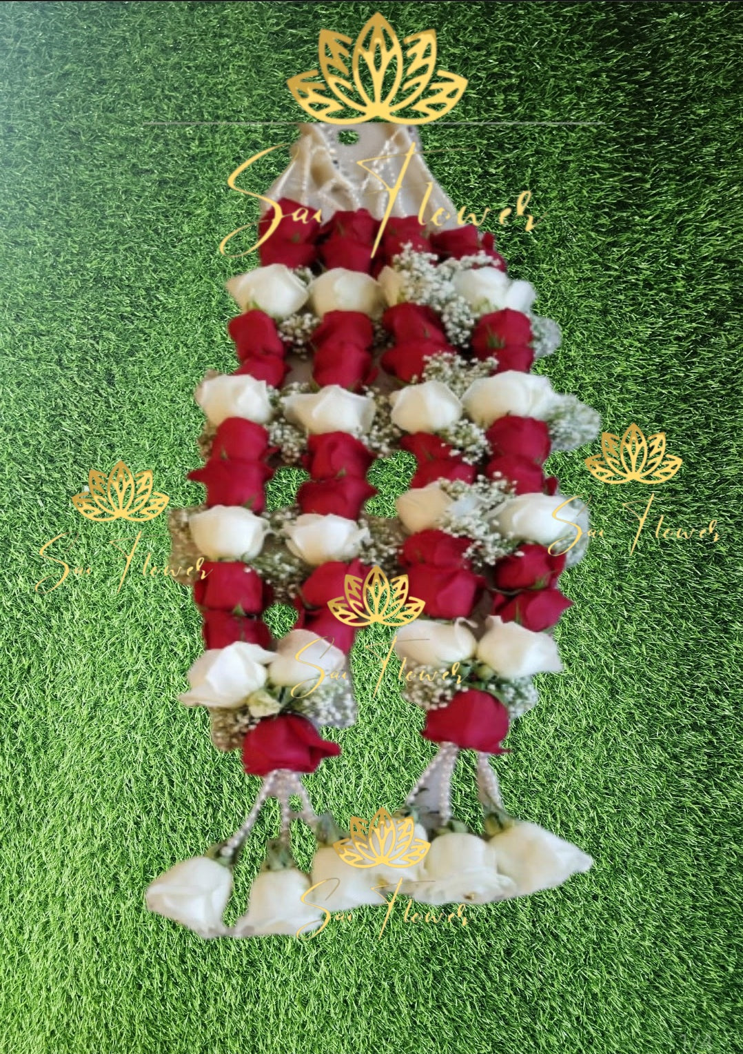 Decorative garland with red and white flowers on a green background