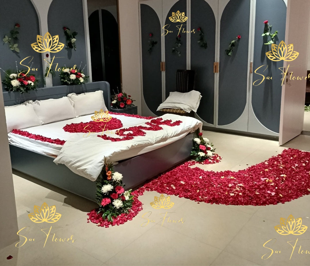 “Romantic red rose bed decoration with fresh flower arrangements and rose petal pathway by SaiFlower”