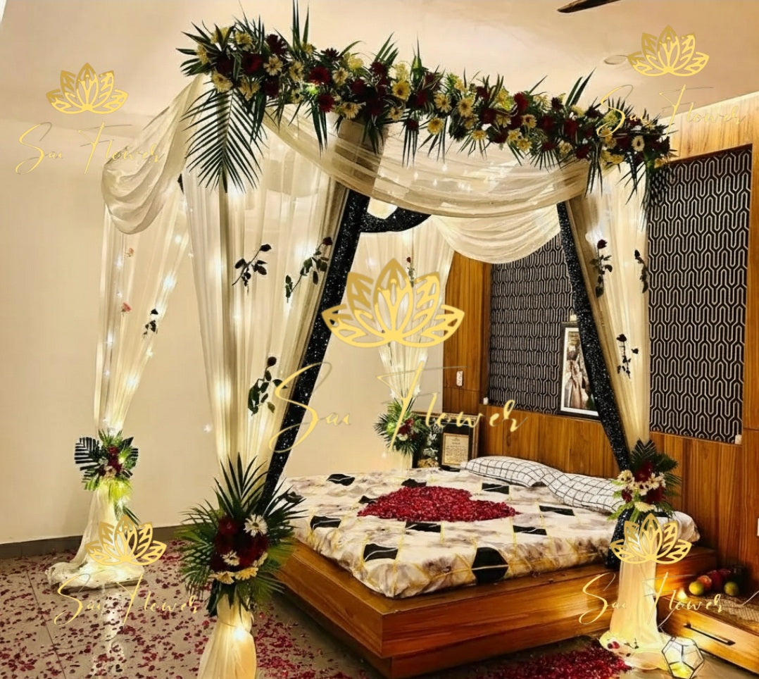 “Modern canopy-style fresh flower bed decoration with cream drapes, LED lights, and red rose petals by SaiFlower for weddings and anniversaries”