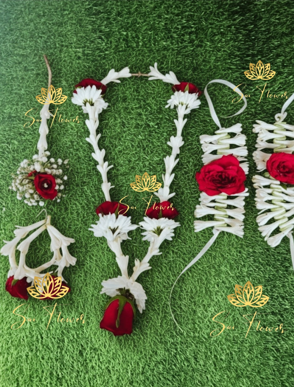 “Red and white fresh flower bridal jewellery set with necklace, earrings, maang tikka, and haathphool handcrafted by SaiFlower”